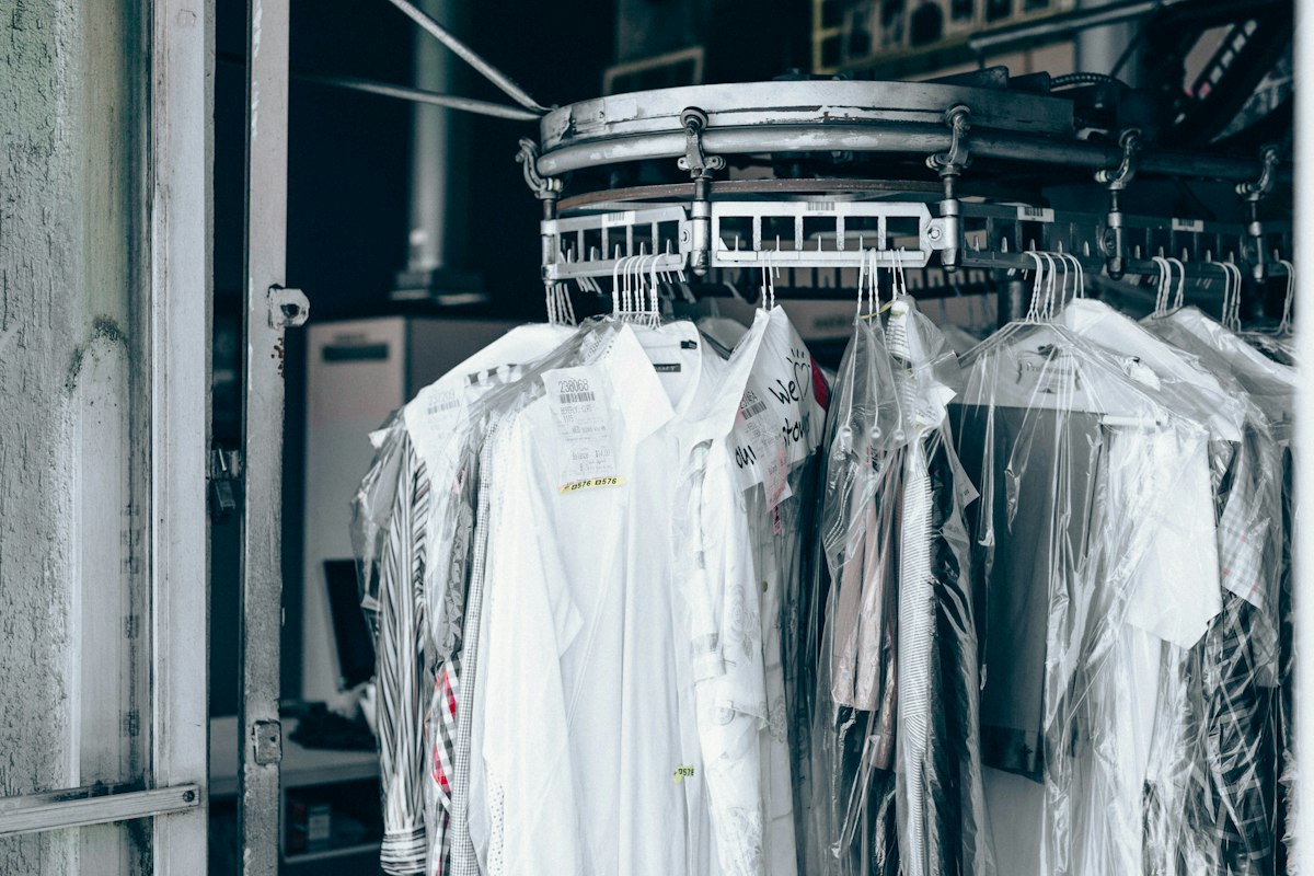 Freshly dry cleaned garments on a store conveyor rack