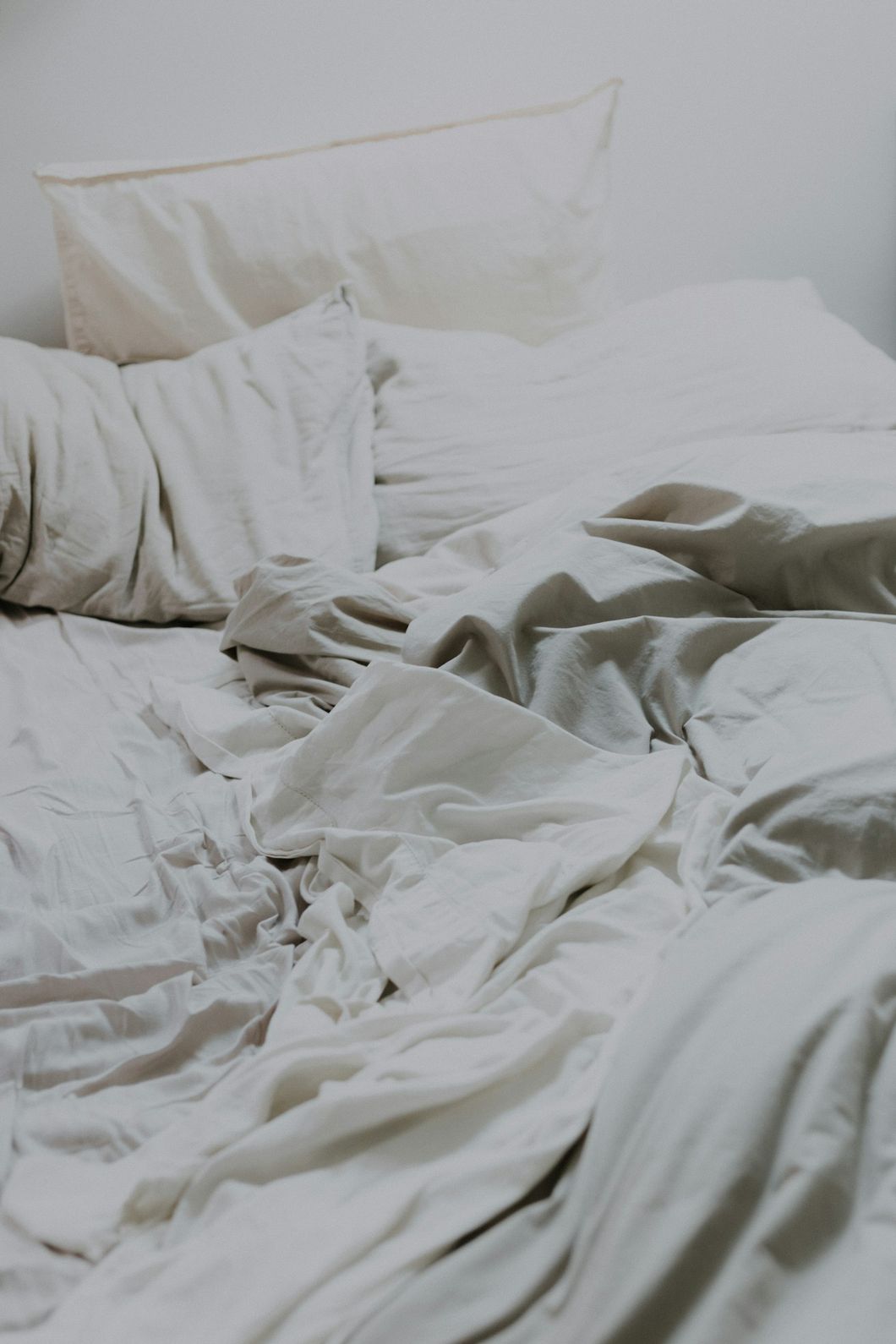 White comforter and pillows on a made bed